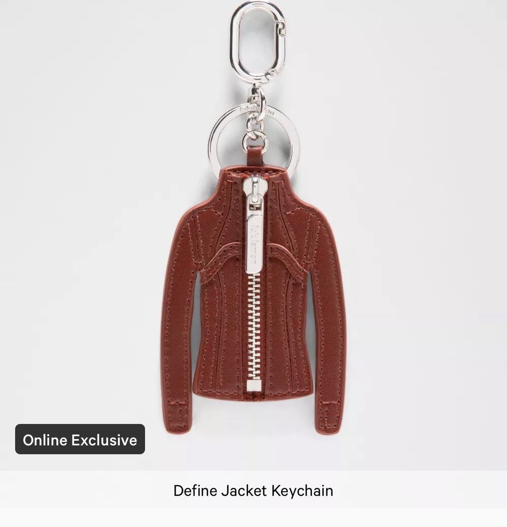 Define Jacket Keychain in cranberry leather with zipper detail. NWT